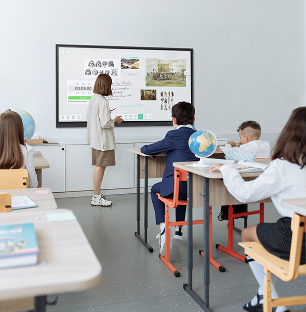The giant touchscreen captures the attention of the entire class.